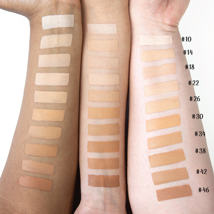 Photograph of Anne T. Dotes Concealer applied to three models' arms. Numbers #10 to #46 ranging from lighter to darker