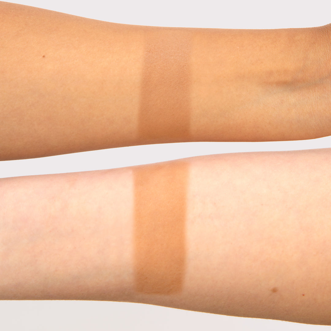 Photograph showing Bahama Mama Travel Size effect on two models' arms