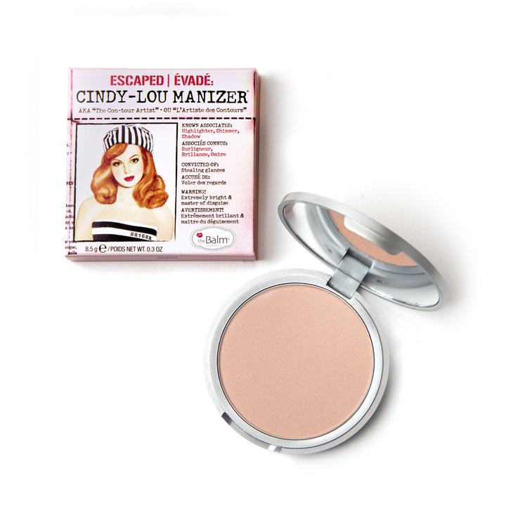 Photograph of Cindy-Lou Manizer highlighter packaging and makeup. makeup half closed