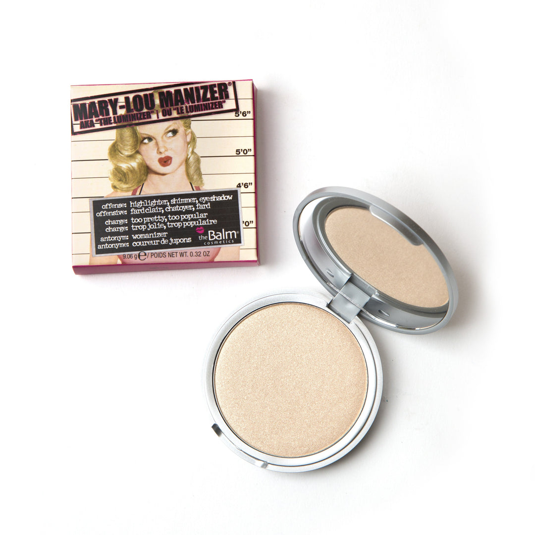 Photograph of Mary-Lou Manizer showing packaging and makeup with lid half closed